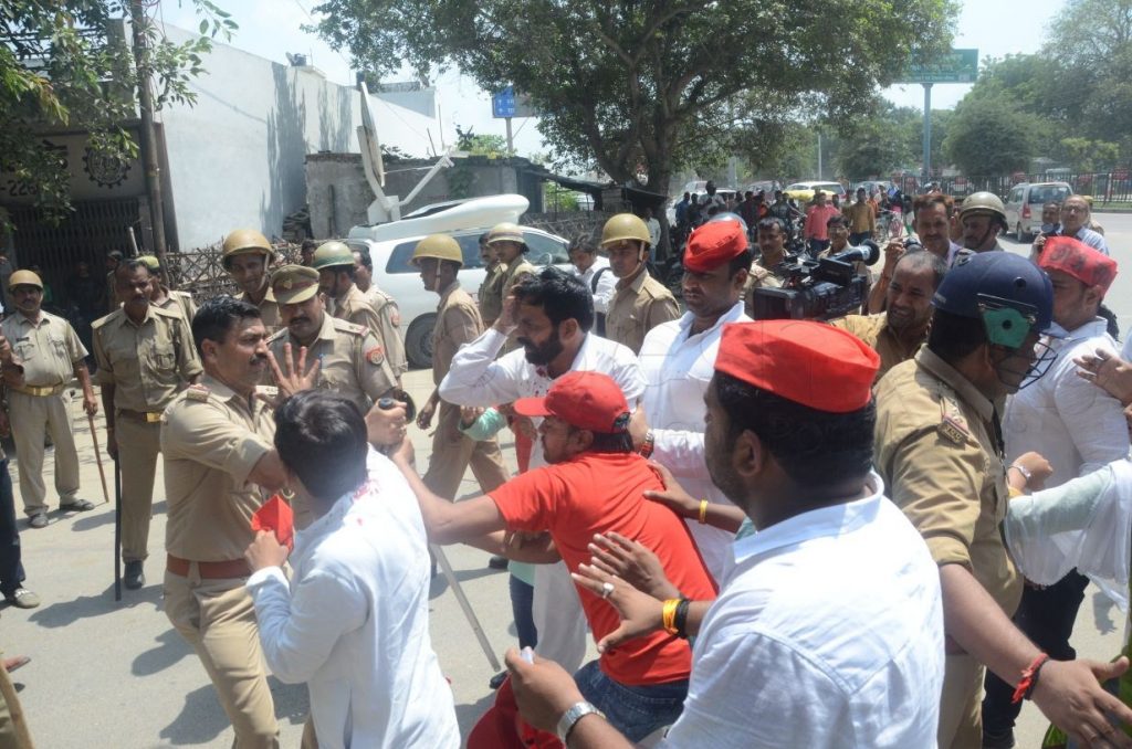 sp activist arrested after lathicharge