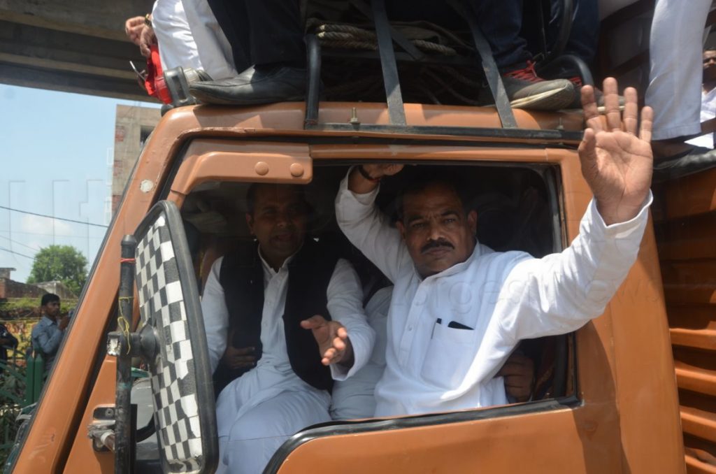 sp activist arrested after lathicharge
