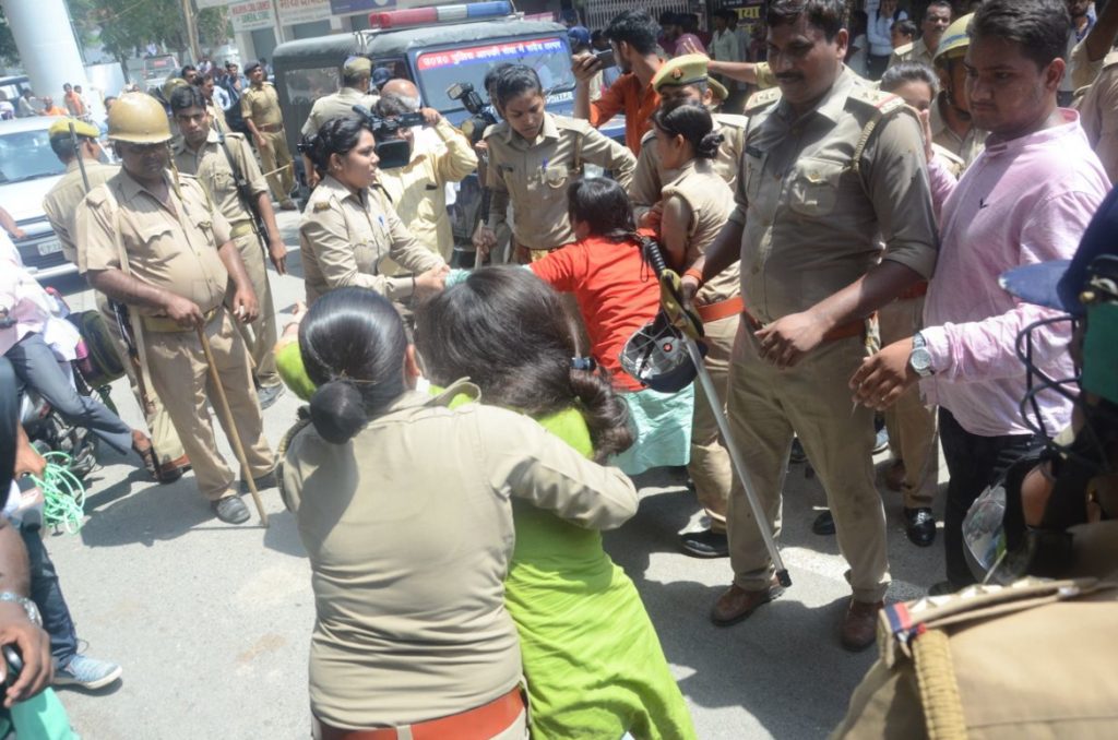 sp activist arrested after lathicharge