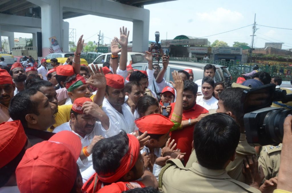 sp activist arrested after lathicharge