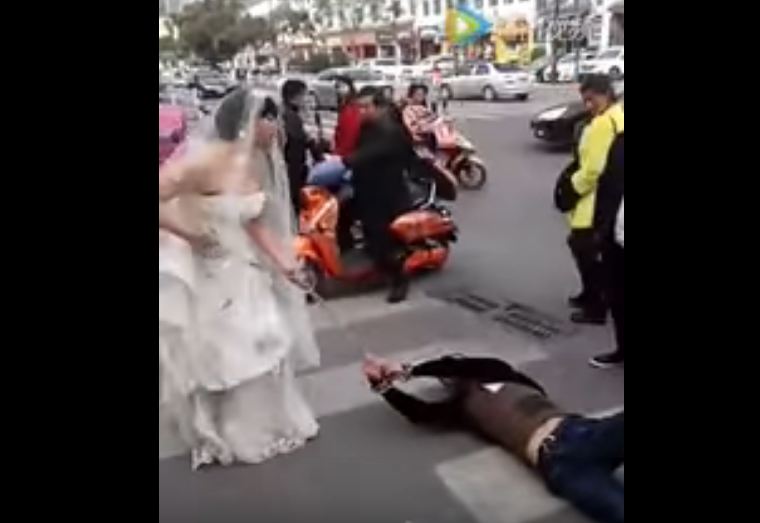 Bride drags groom on the streets