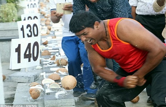 Man smashes coconuts