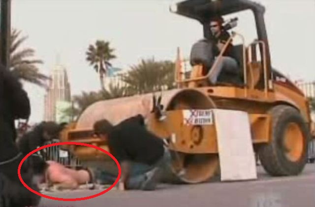 man stunt road roller climbs
