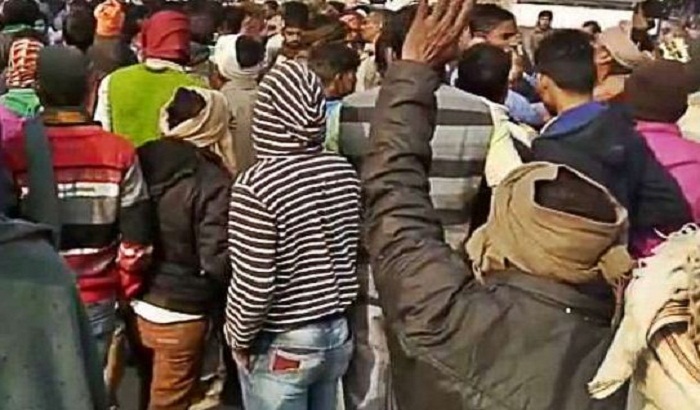 Disturbed by the overloaded trucks the villagers blocked the way